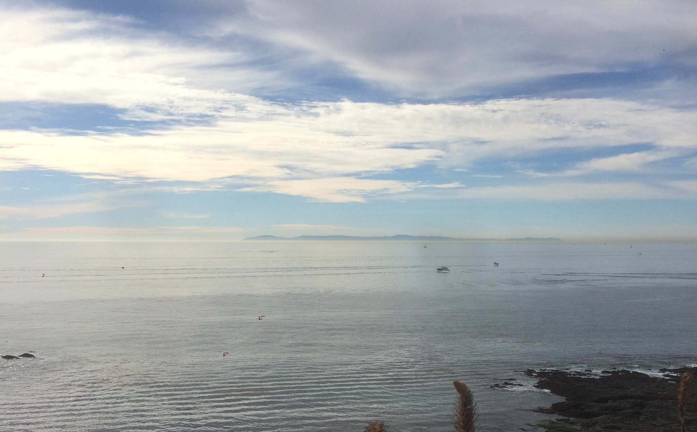 Ocean and cloudy sky with rocks